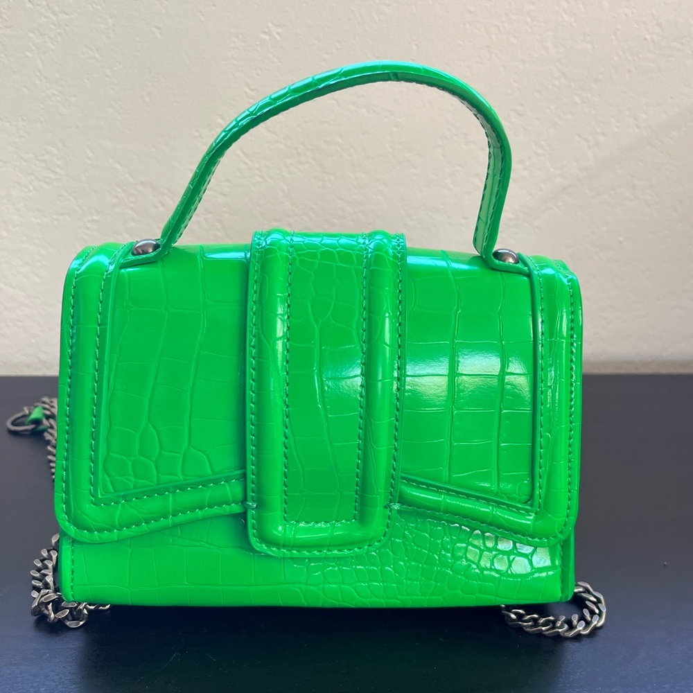 Green Purse. Small. Never used. note scuff marks in photo. Can be buffed out.